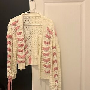 Trendy Boutique Cream Cardigan with Pink Ribbon Accents